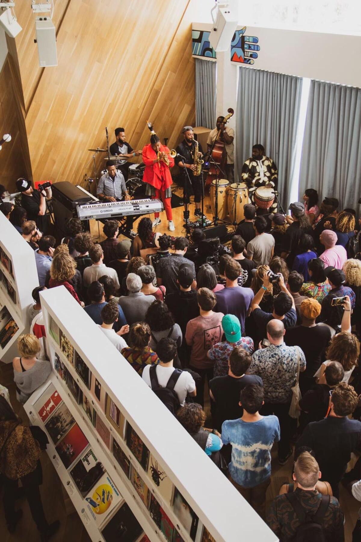 A band performs in an office for company employees