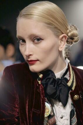 A made-up model waits backstage at Rodarte's fall 2009 fashion show at New York Fashion Week.