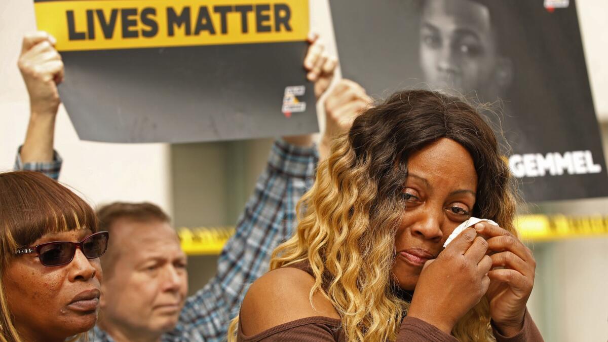 LaTisha Nixon, the mother of Gemmel Moore, wipes away tears during a press conference by members of Color of Change, an online racial justice organization, in January.