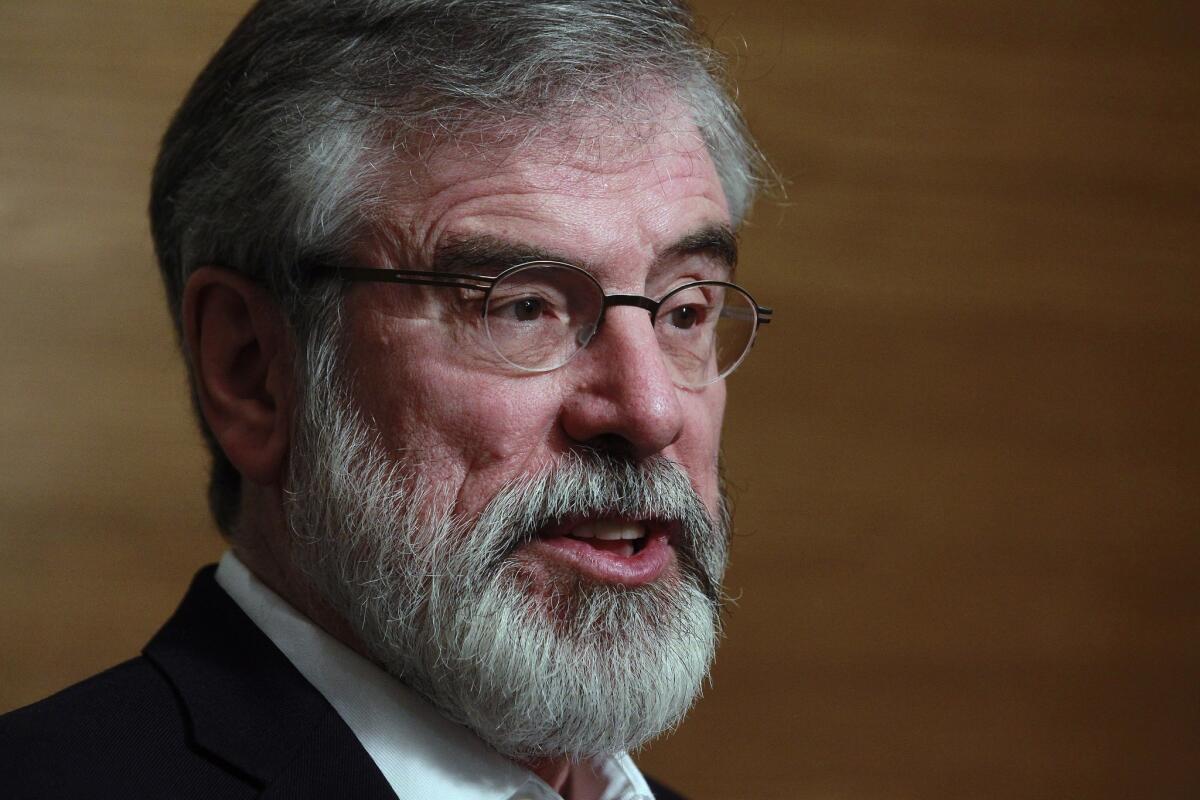 Sinn Fein party leader Gerry Adams talks to members of the media in Dundalk, Ireland, on Sunday.