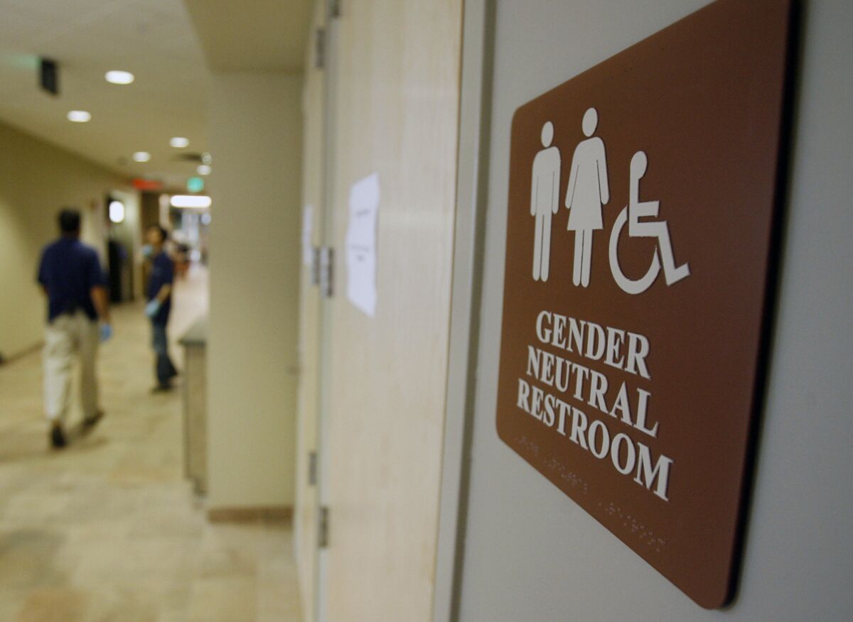 A sign marks the entrance to a gender-neutral restroom at the University of Vermont in Burlington in Feburary 2007.