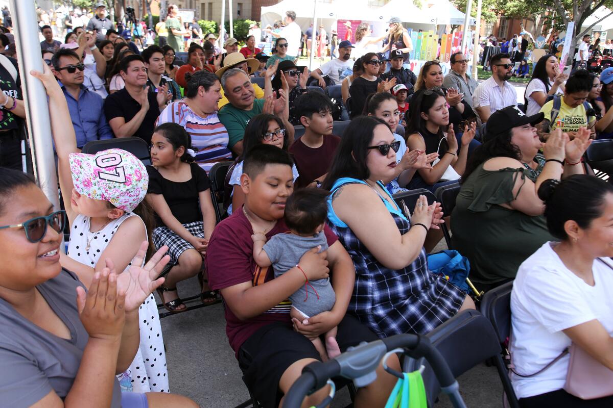 Guests applaud at the Los Angeles Times en Espanol stage area during the Los Angeles Times Festival of Books 