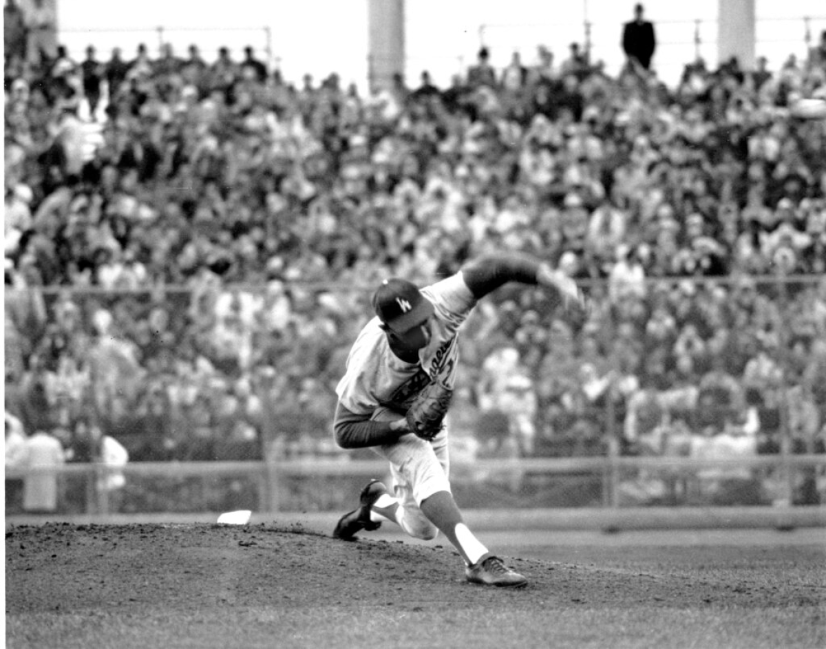 Dodgers pitcher Sandy Koufax delivers against the Minnesota Twins at Metropolitan Stadium.