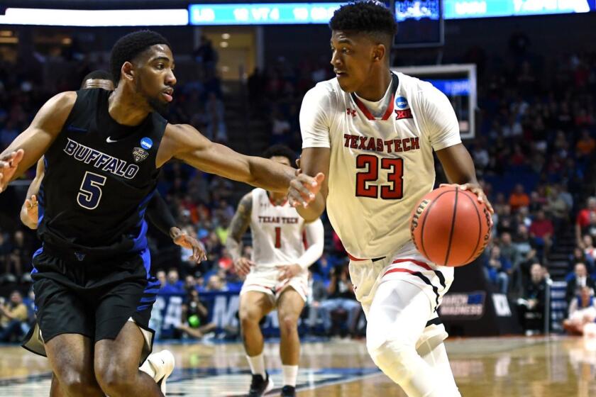 TULSA, OKLAHOMA - MARCH 24: Jarrett Culver #23 of the Texas Tech Red Raiders drives past CJ Massinburg #5 of the Buffalo Bulls during the second half of the second round game of the 2019 NCAA Men's Basketball Tournament at BOK Center on March 24, 2019 in Tulsa, Oklahoma. (Photo by Stacy Revere/Getty Images) ** OUTS - ELSENT, FPG, CM - OUTS * NM, PH, VA if sourced by CT, LA or MoD **