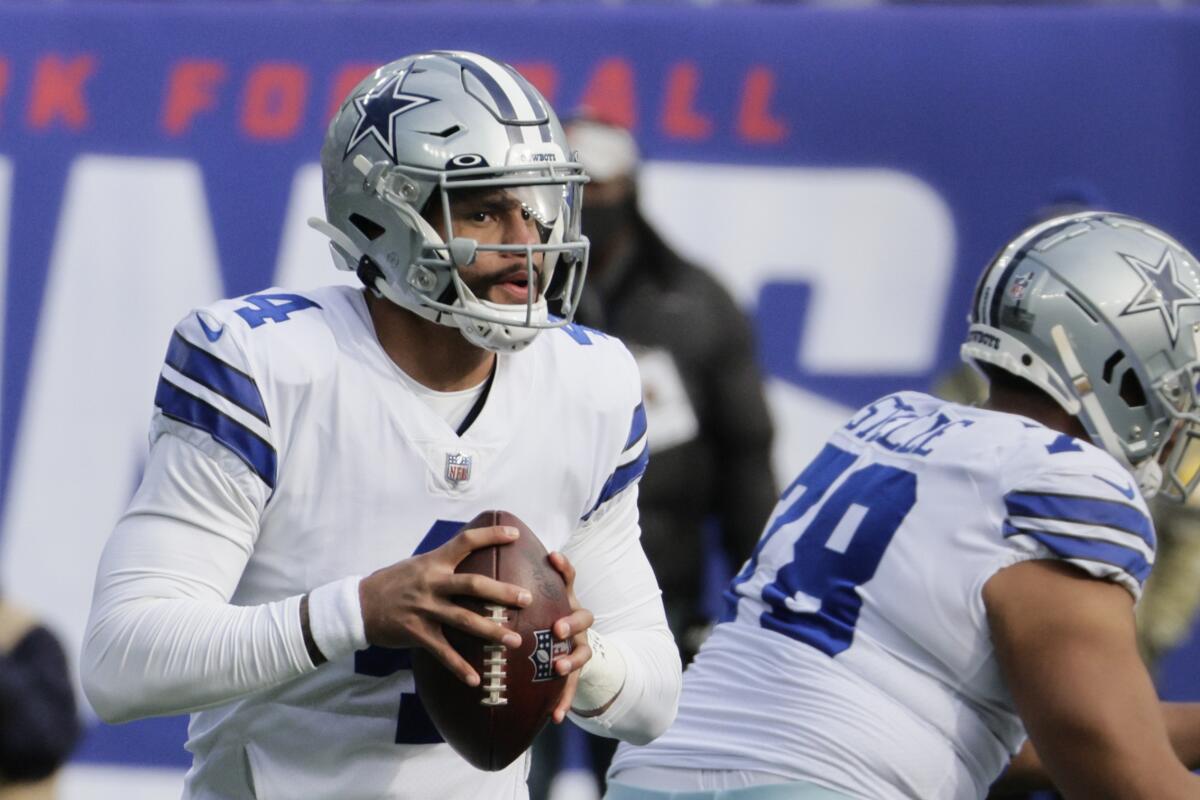 Dallas Cowboys quarterback Dak Prescott looks to pass in the first half against the New York Giants.