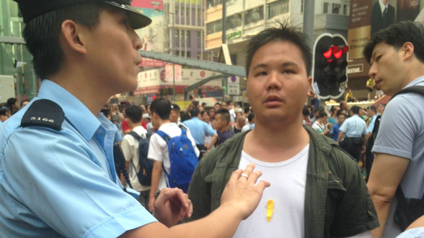 A Hong Kong police officer confronts a protester.