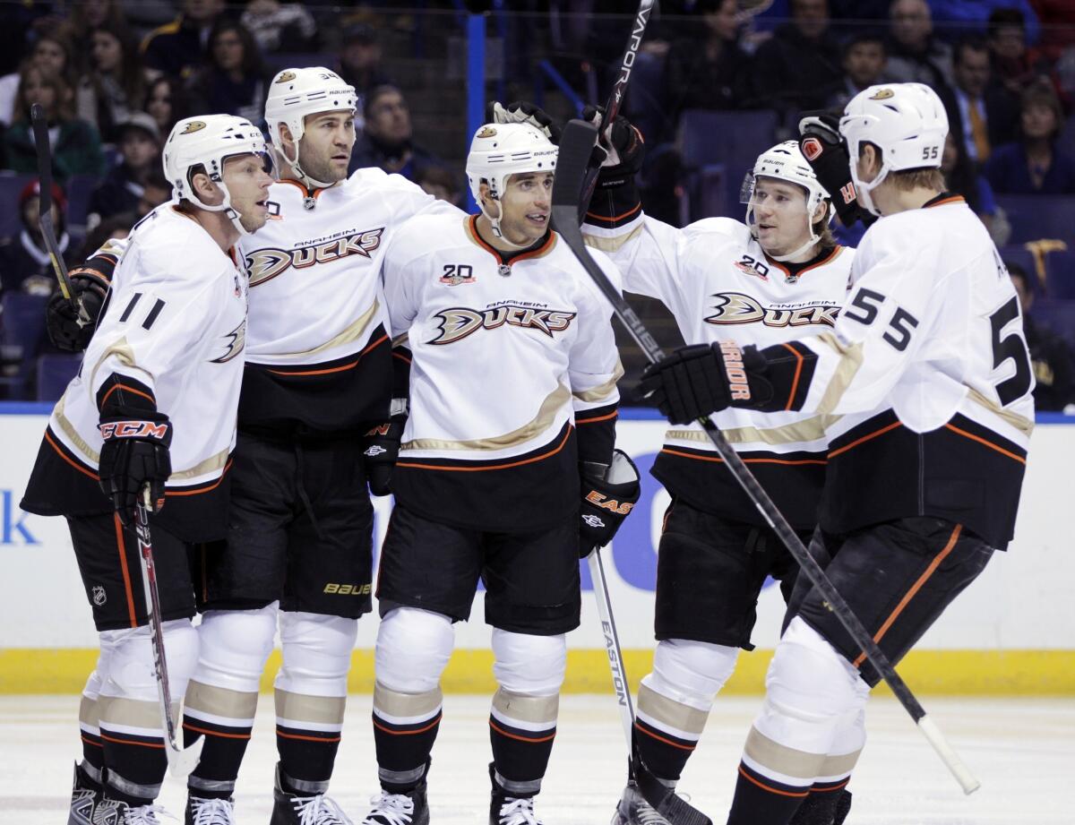 Ducks forward Andrew Cogliano, center, is congratulated after scoring a goal during the Ducks' 5-2 victory over the St. Louis Blues on Saturday.