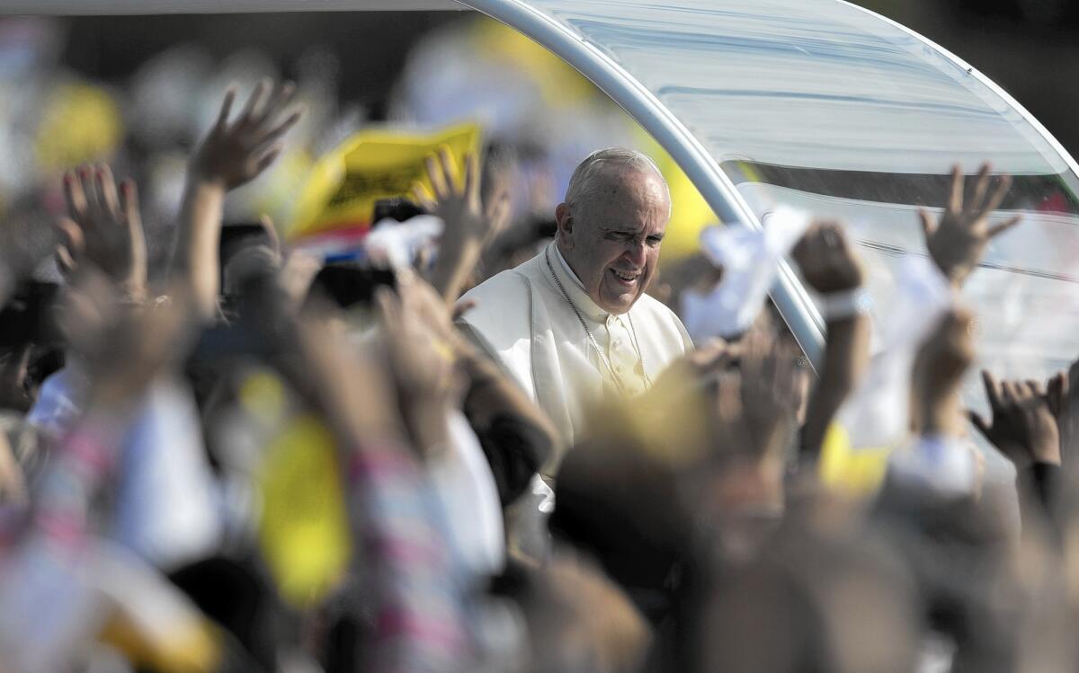 Pope Francis arrives to celebrate a Mass in Asuncion, Paraguay. Earlier he visited a slum to talk about equality. Paraguay is the final leg of his tour of three of South America's poorest countries; he also visited Ecuador and Bolivia.