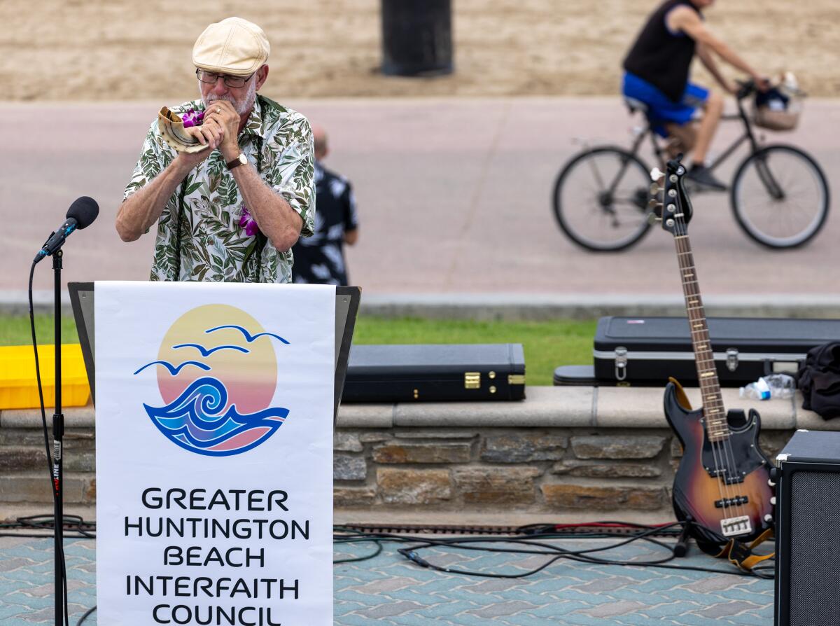 Rabbi Stephen Einstein of Congregation B'nai Tzedek blows the shofar during the 14th annual Blessing of the Waves ceremony.