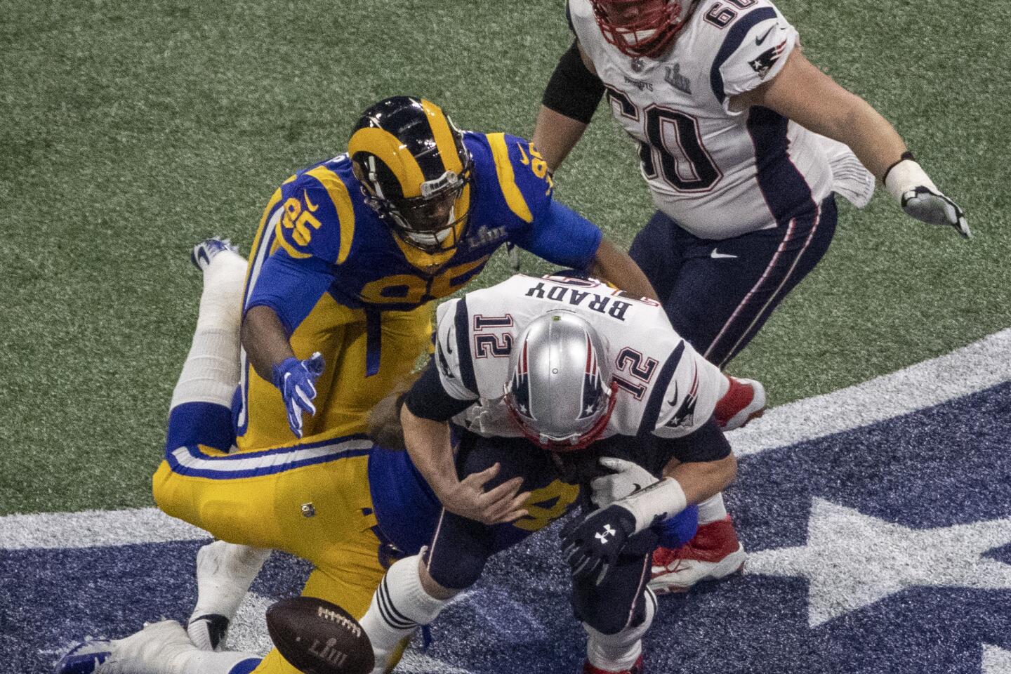 Los Angeles Rams running back Todd Gurley spits water as he sits