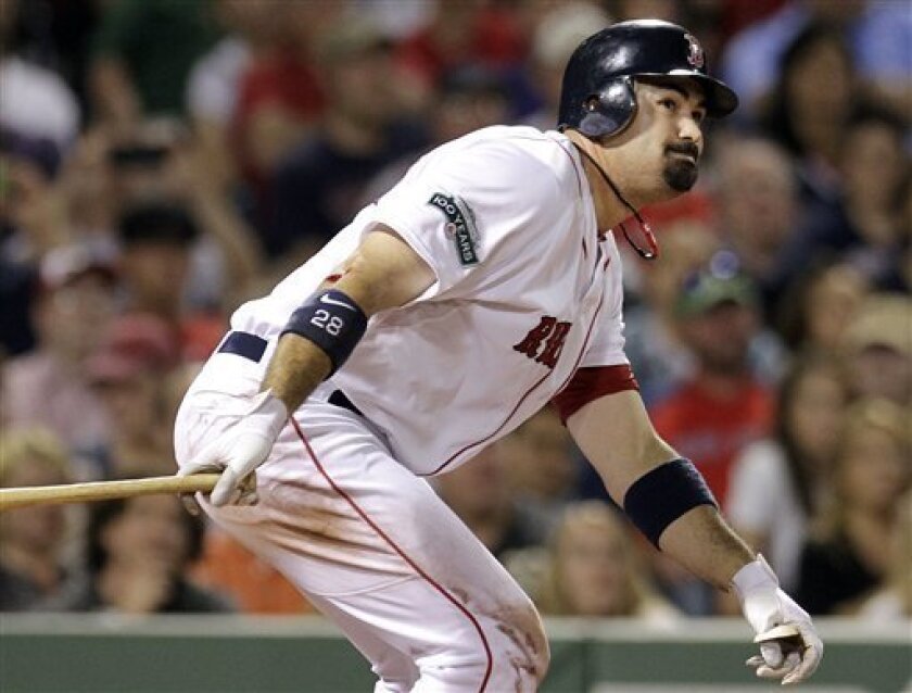 Boston Red Sox's Adrian Gonzalez hits an RBI double against the Detroit Tigers during the seventh inning of a baseball game at Fenway Park in Boston on Wednesday, May 30, 2012. (AP Photo/Elise Amendola)