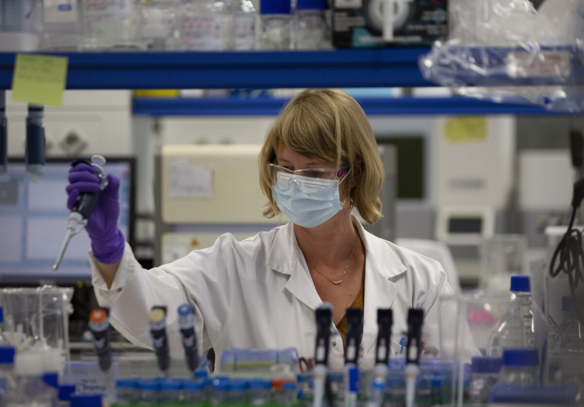 A lab technician conducts COVID-19 research at Johnson & Johnson subsidiary Janssen Pharmaceuticals in Beerse, Belgium.