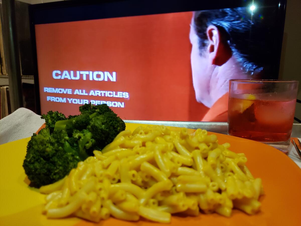 The 1971 alien contagion movie "Andromeda Strain" with Kraft mac and cheese and Campari soda.