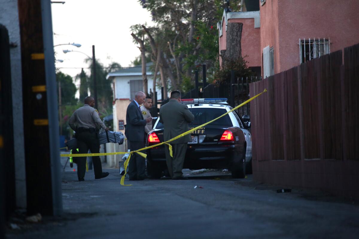 An investigation was underway in an alley at 106th and Vermont streets, where a woman died of a gunshot wound early Wednesday and near where L.A. County sheriff's deputies later fatally shot a man.