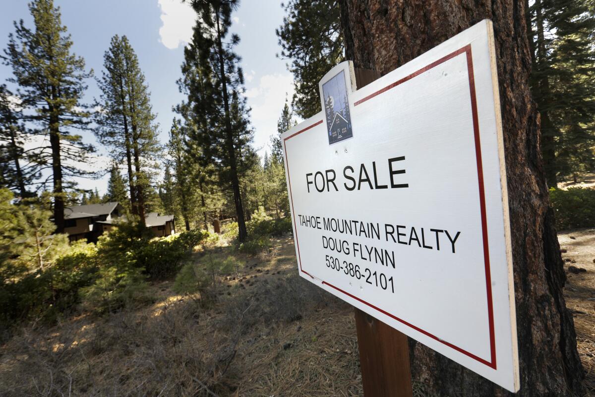 A "for sale" sign posted in Gray’s Crossing, an upscale new housing development in Truckee.