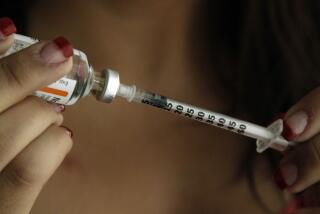 Judith Garcia, 19, fills a syringe as she prepares to give herself an injection of insulin at her home in the Los Angeles suburb of Commerce, Calif., Sunday, April 29, 2012. A major study, released Sunday, tested several ways to manage blood sugar in teens newly diagnosed with diabetes and found that nearly half of them failed within a few years and 1 in 5 suffered serious complications. Garcia still struggles to manage her diabetes with metformin and insulin years after taking part in the study at Children's Hospital Los Angeles. (AP Photo/Reed Saxon)