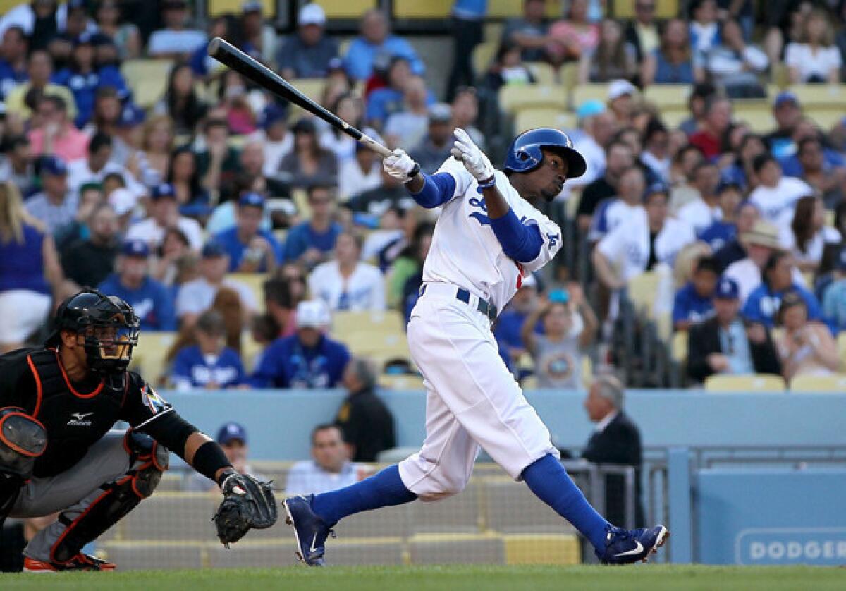 Dodgers' Dee Gordon hits a solo home run in the third inning against the Miami Marlins.