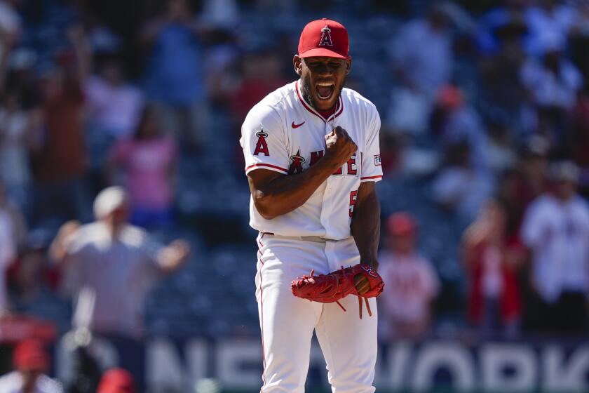Los Angeles Angels relief pitcher Roansy Contreras reacts after striking out New York Mets' Harrison Bader for the final out of a baseball game, Sunday, Aug. 4, 2024, in Anaheim, Calif. (AP Photo/Ryan Sun)
