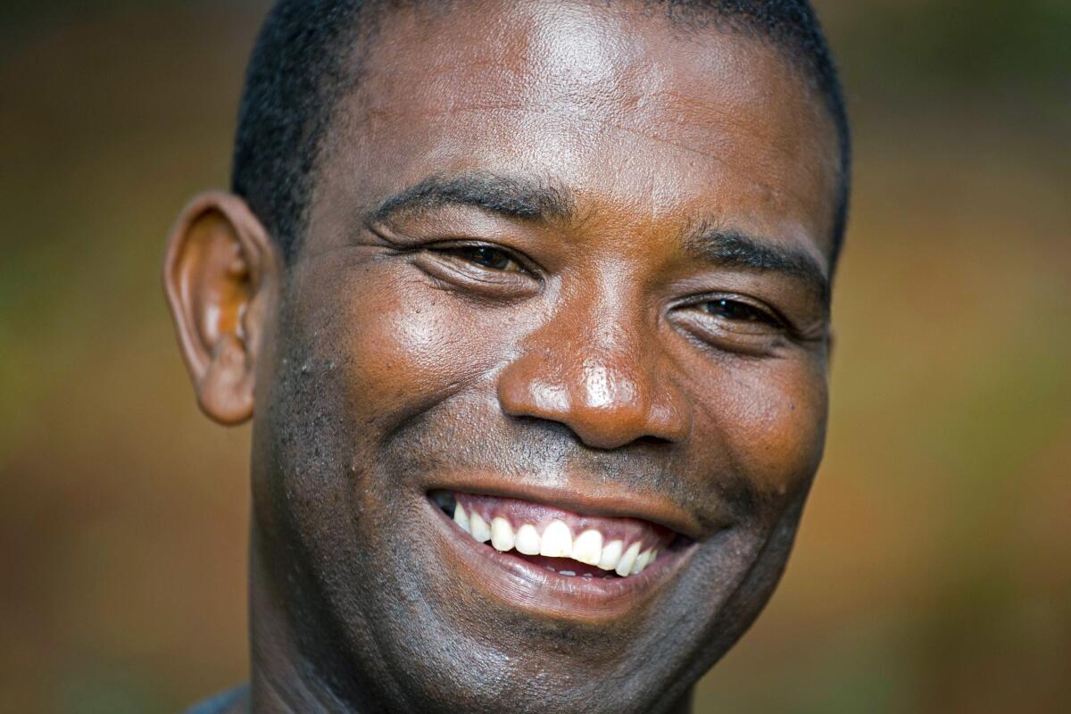 Guy Philippe smiles during an interview in Pestel, Haiti.