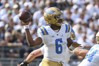 UCLA quarterback Justyn Martin (6) throws a pass against Penn State during the third quarter of an NCAA college football game, Saturday, Oct. 5, 2024, in State College, Pa. (AP Photo/Barry Reeger)