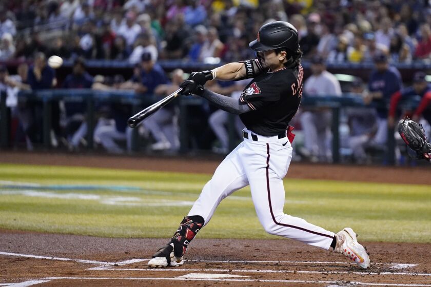 Arizona Diamondbacks' Corbin Carroll connects for a two-run home run against the Boston Red Sox during the first inning of a baseball game Sunday, May 28, 2023, in Phoenix. (AP Photo/Ross D. Franklin)