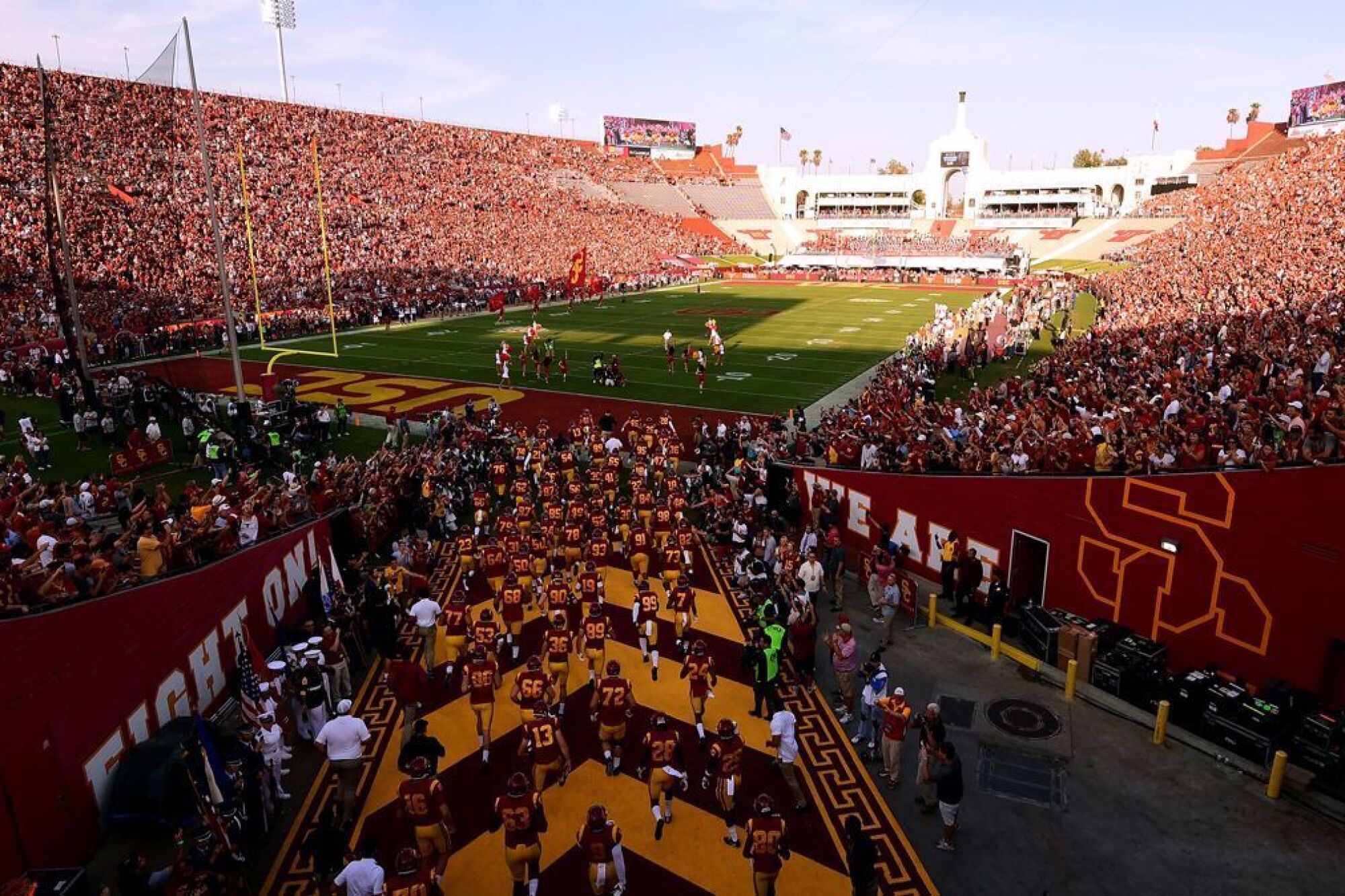 USC players take the field before a game against Fresno State.