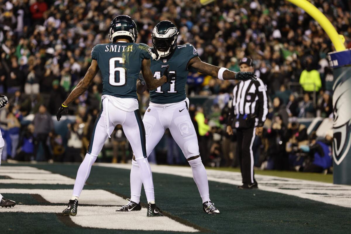 The Eagles' DeVonta Smith (6) celebrates his touchdown catch with A.J. Brown.