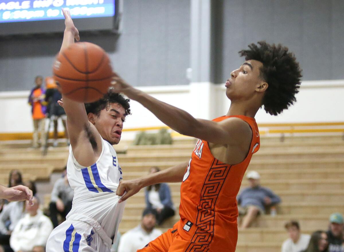 Pacifica Christian Orange County's Houston Mallette, right, shown in a Nov. 20 game against Santa Margarita, led the Tritons to an 85-61 win over University on Tuesday at the Corona del Mar Beach Bash.