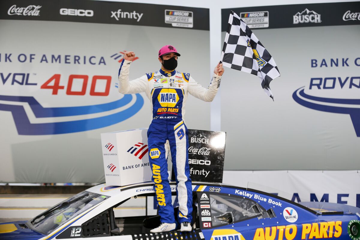 Chase Elliott celebrates in victory lane after winning a NASCAR Cup Series auto race at Charlotte Motor Speedway in Concord, N.C., Sunday, Oct. 11, 2020. (AP Photo/Nell Redmond)