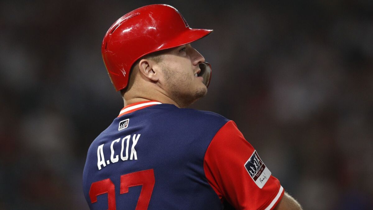 The Angels' Mike Trout wears a jersey bearing a name of his late brother-in-law, Aaron Cox, Friday against the Houston Astros.