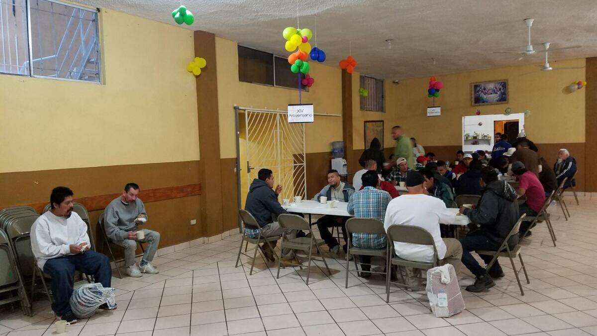 Migrants and deportees at Casa Migrante shelter run by Catholic priests in the border city of Nuevo Laredo, Mexico, gather for breakfast before heading to work earlier this month.
