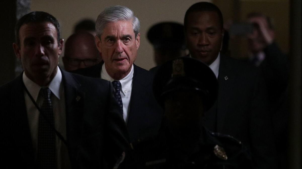 Special counsel Robert Mueller (2nd L) leaves after a closed meeting with members of the Senate Judiciary Committee on June 21, 2017 at the Capitol in Washington.