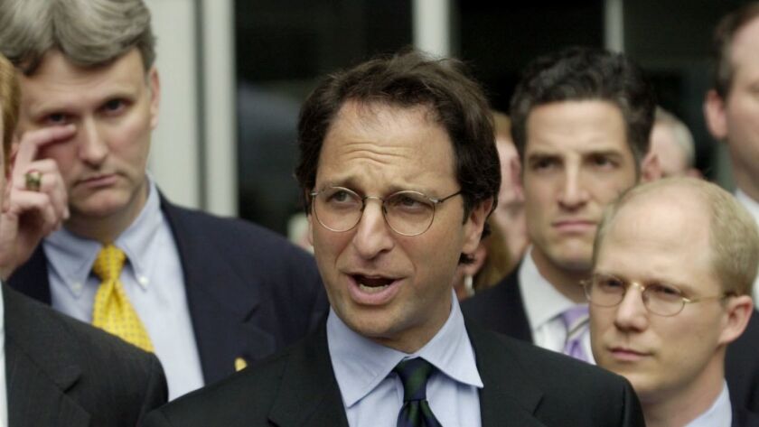 In this 2003 photo, Andrew Weissmann, center, is joined by other members of the Enron task force.