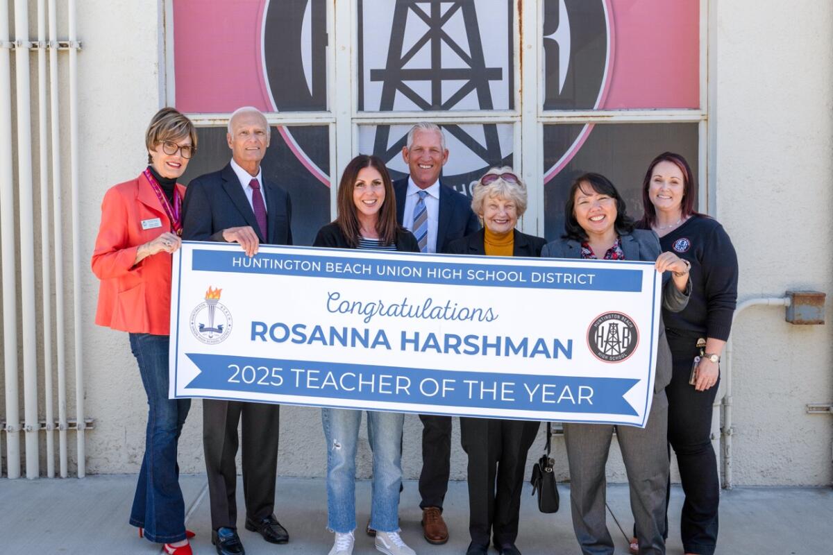 Rosanna Harshman, third from left, with Huntington Beach Union High School District staff and trustees.