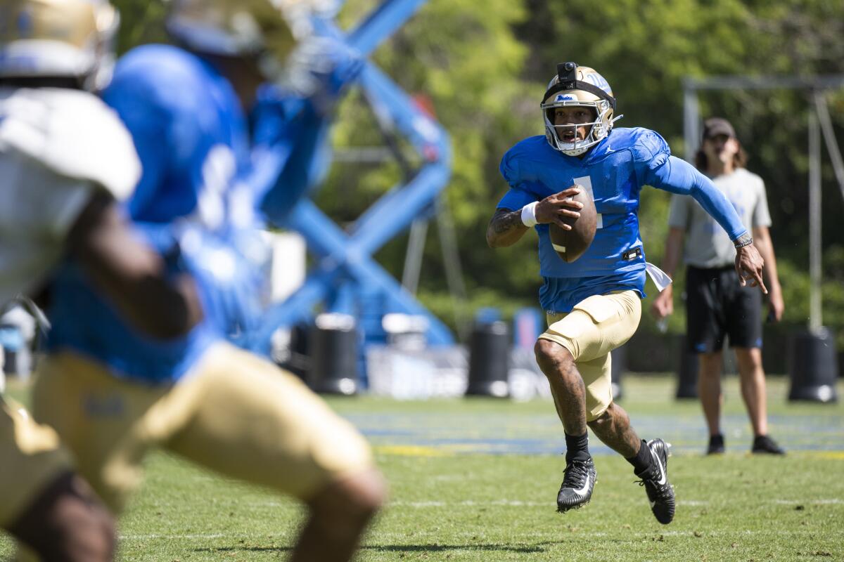 UCLA quarterback Dorian Thompson-Robinson runs with the ball during the Bruins' Spring Showcase in April.