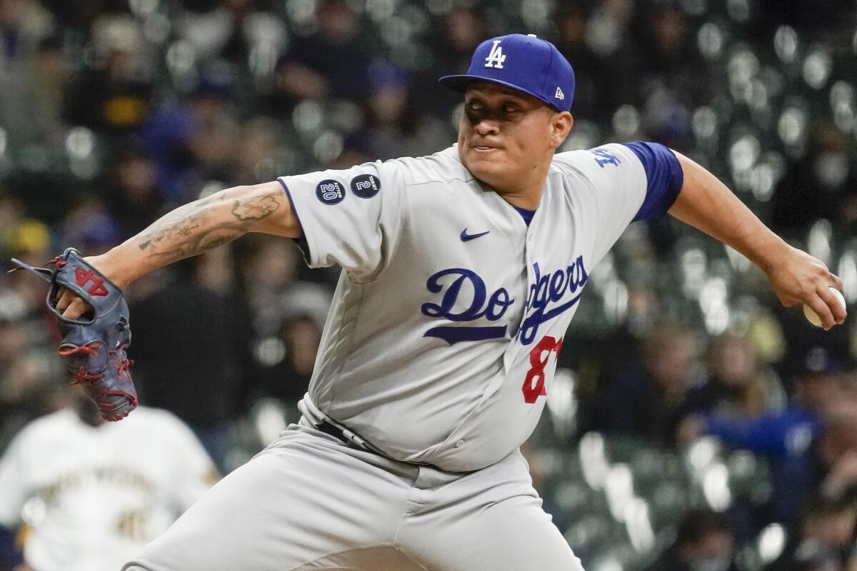 Los Angeles Dodgers' Victor Gonzalez throws against the Brewers in April 2021.