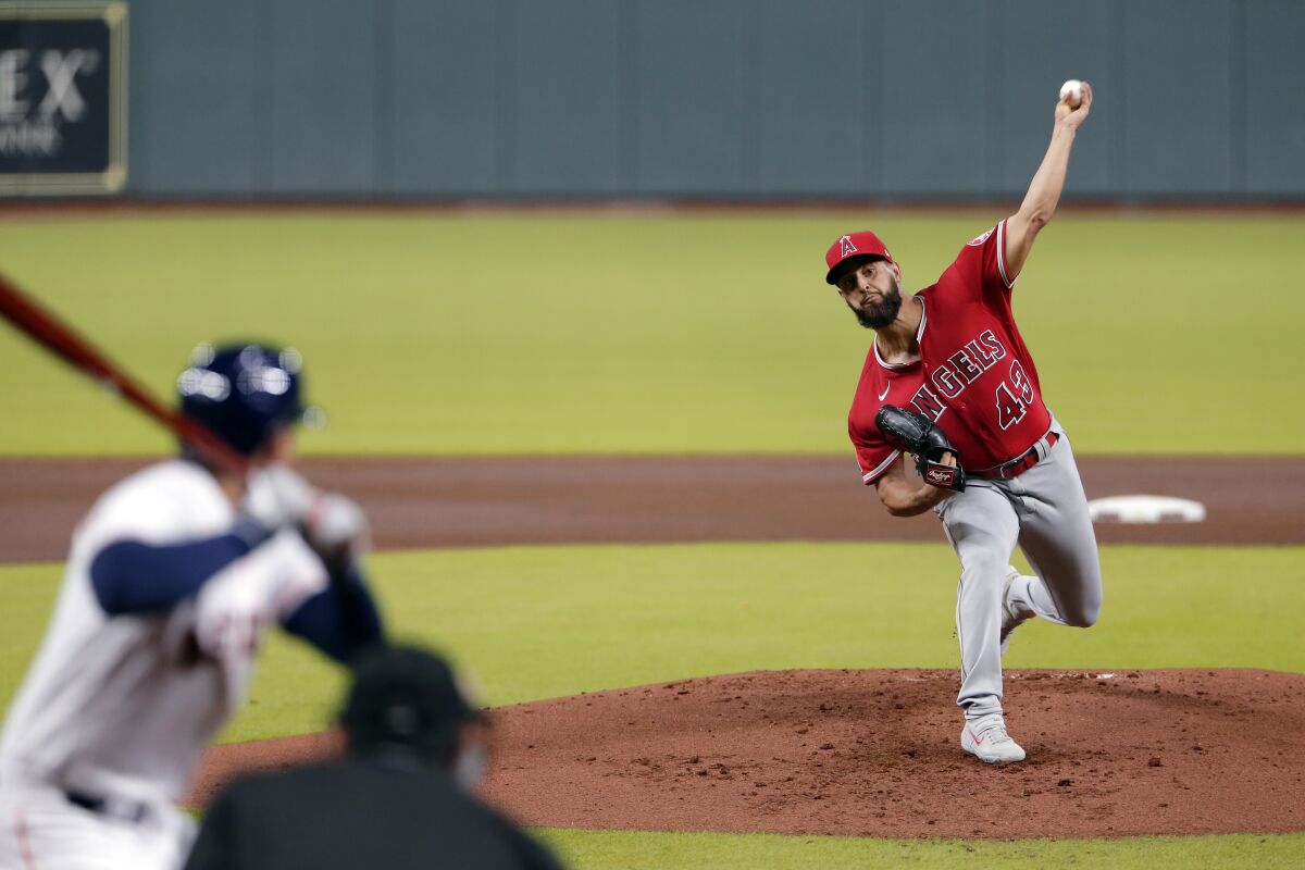 Angels starting pitcher Patrick Sandoval throws against Houston Astros George Springer.