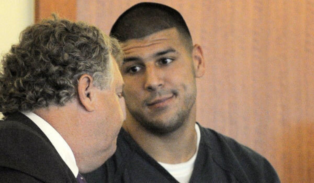 Former New England tight end Aaron Hernandez, right, with attorney Michael Fee during a bail hearing in Fall River Superior Court on June 27 in Fall River, Mass.