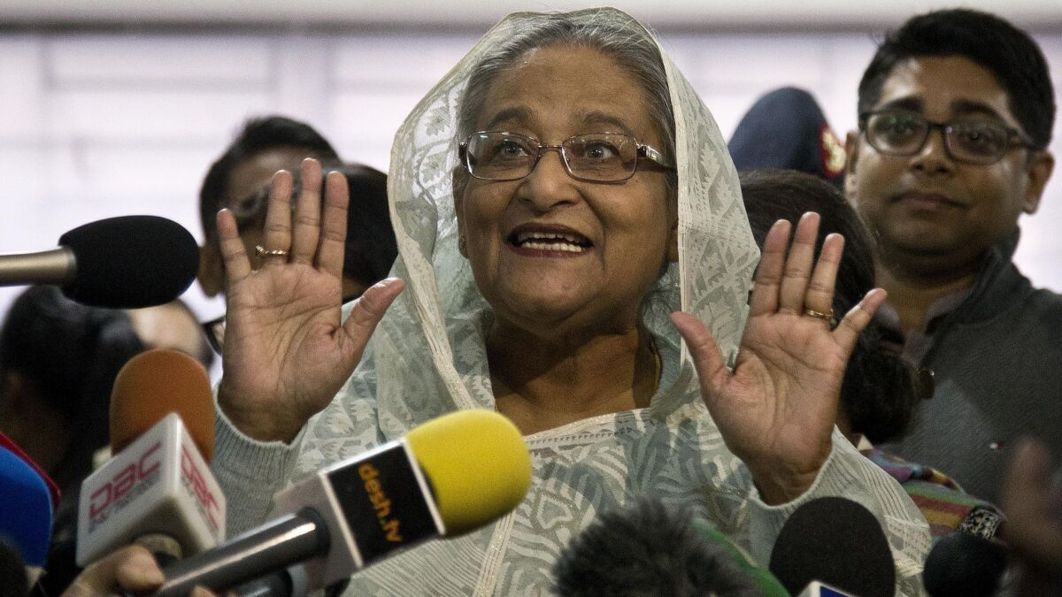 Bangladesh Prime Minister Sheik Hasina Wajed speaks to the media after casting her vote in Dhaka.