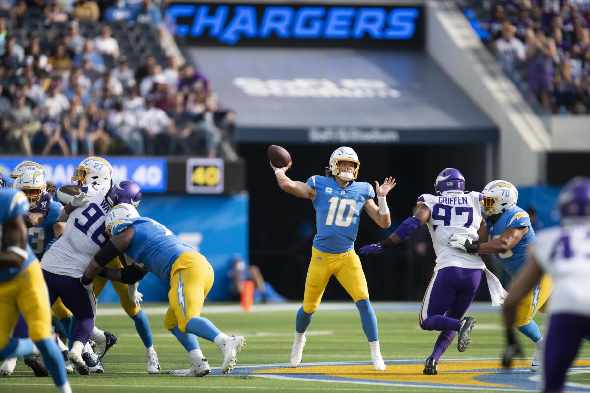 Chargers quarterback Justin Herbert throws against the Vikings.