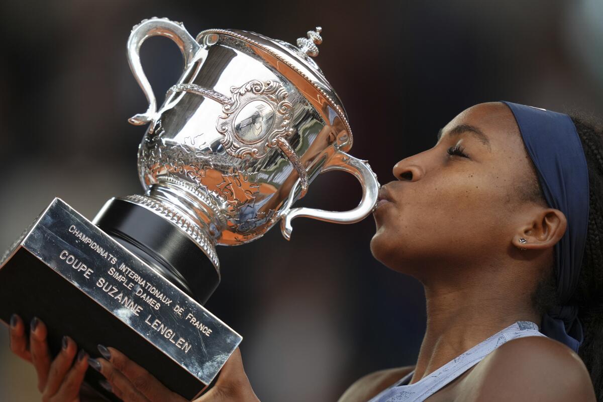 Coco Gauff kisses the trophy afger defeating Aryna Sabalenka in the French Open women's singles final on Saturday.