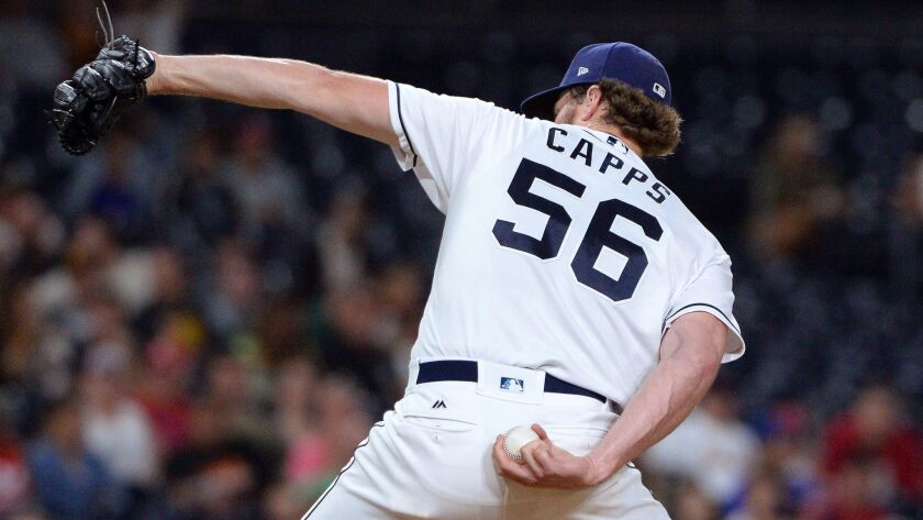 San Diego Padres relief pitcher Carter Capps winds up during the ninth inning of a baseball game against the St. Louis Cardinals on Tuesday, Sept. 5, 2017, in San Diego.