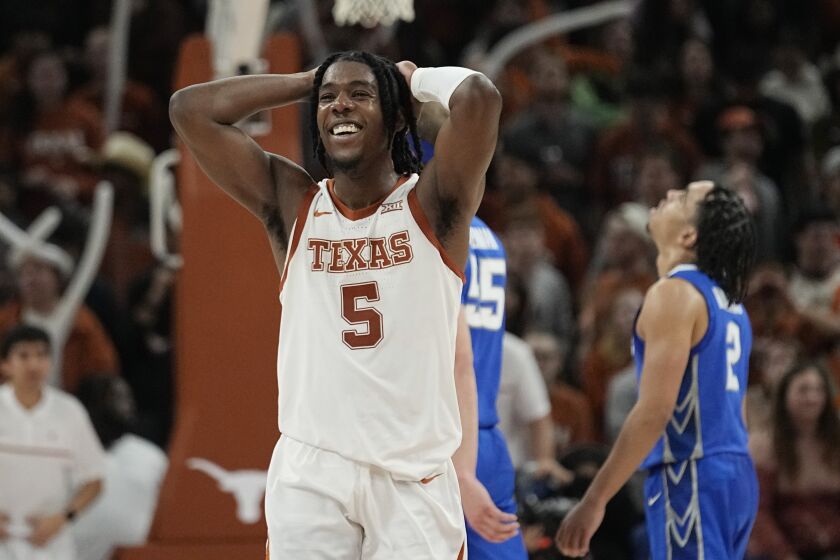 Texas guard Marcus Carr (5) smiles after a play against Creighton during the second half of an NCAA college basketball game in Austin, Texas, Thursday, Dec. 1, 2022. (AP Photo/Eric Gay)