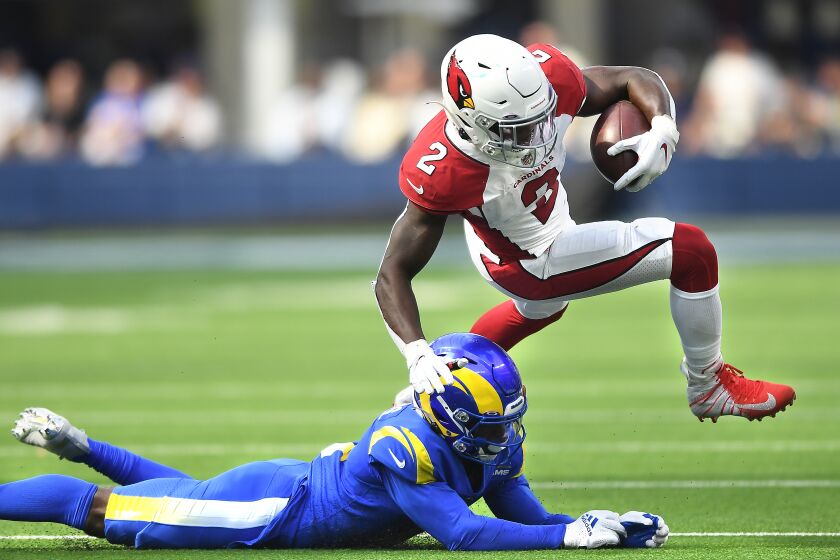 Inglewood, CA. October 3, 2021: Cardinals running back Chase Edmonds is brought down.