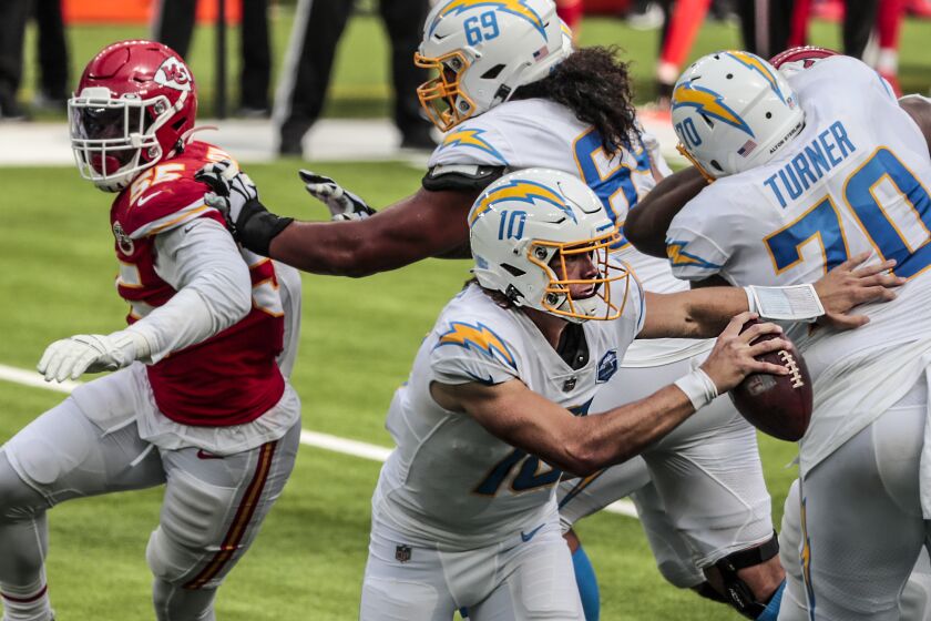 Inglewood, CA, Sunday, September 20, 2020 - Quarterback Justin Herbert #10 of the Los Angeles Chargers scrambles from the pocket during a second half drive against Kansas City Chiefs at SoFi Stadium. (Robert Gauthier/ Los Angeles Times)