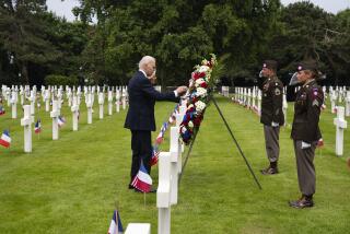President Joe Biden and first lady Jill Biden lay a wreath in the Normandy American Cemetery following a ceremony to mark the 80th anniversary of D-Day, Thursday, June 6, 2024, in Normandy. (AP Photo/Evan Vucci)