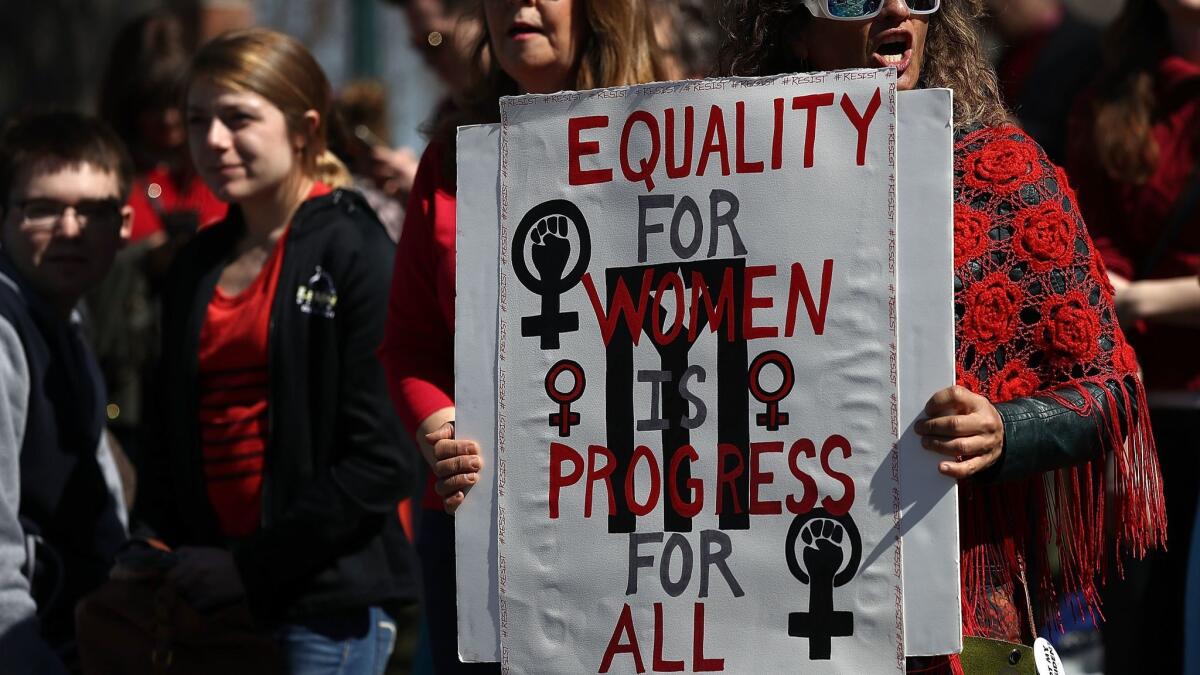 Women's rights supporters gather for a news conference outside the U.S. Capitol to mark International Women's Day on March 8.