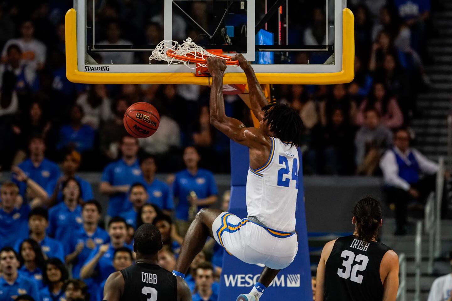 UCLA forward Jalen Hill (24) dunks the ball during the first half of a game against Long Beach State on Nov. 6 at Pauley Pavilion.