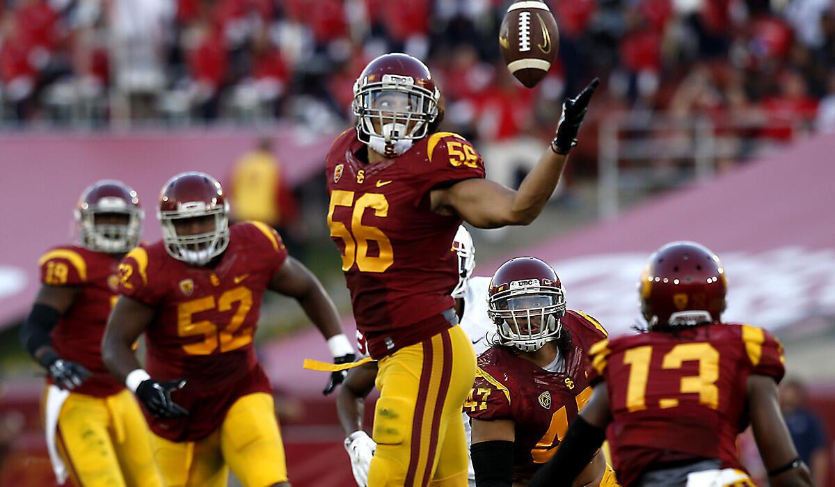 USC linebacker Anthony Sarao intercepts a pass against the Fresno State.