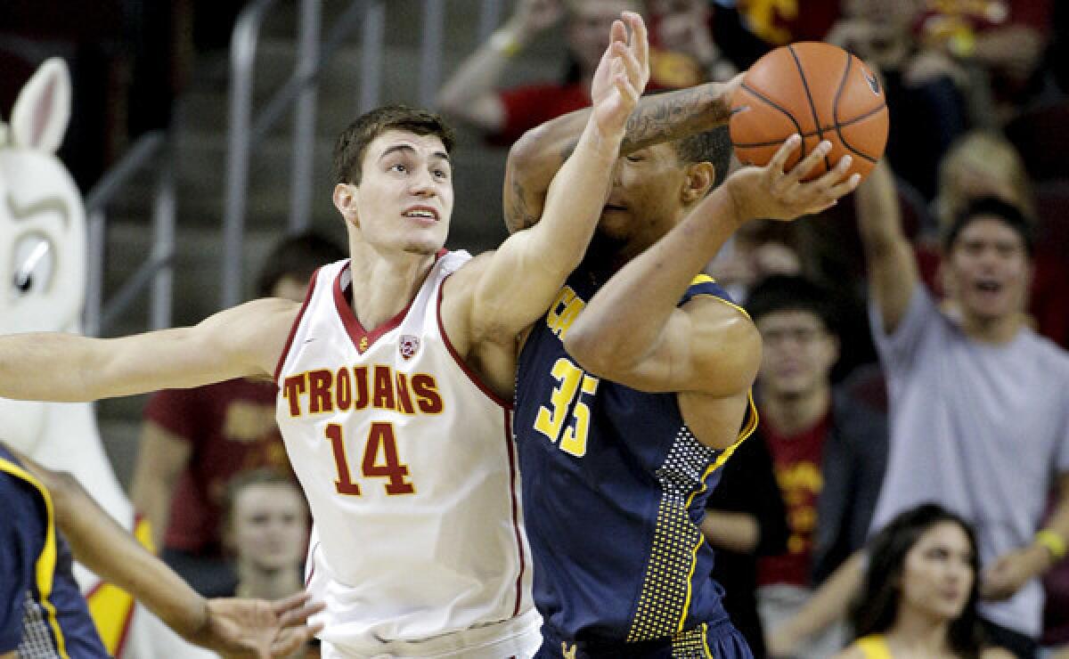 USC's Strahinja Gavrilovic, left, defends against California's Richard Solomon during the first half of Wednesday's game.